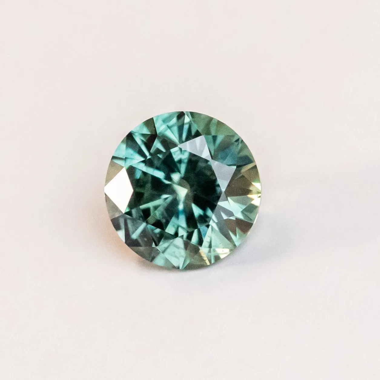 2.25CT ROUND PRECISION CUT MONTANA SAPPHIRE, MEDIUM GREENISH TEAL, 7.74X5.13MM