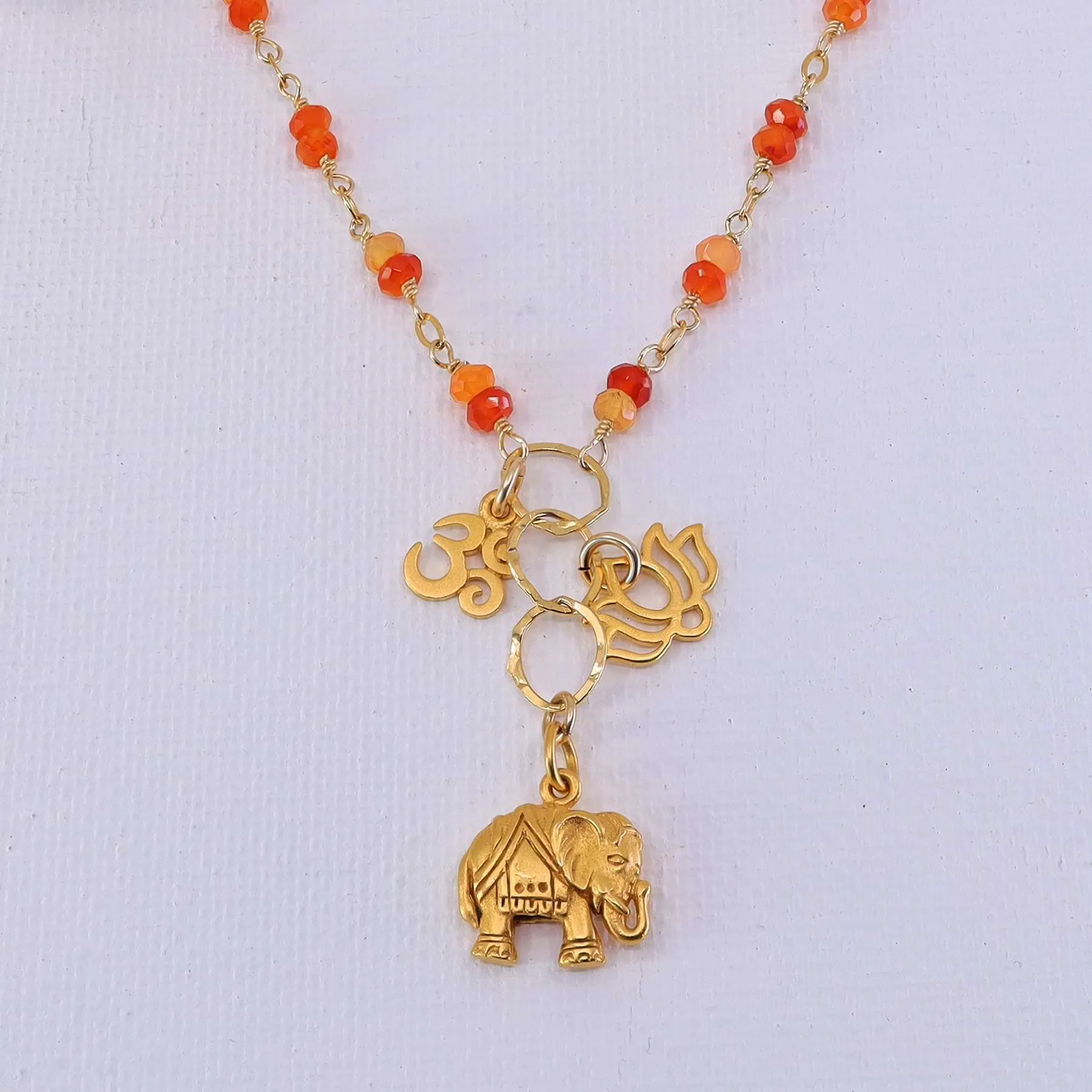 Bali in Bloom - Carnelian Gold Elephant Lotus Om Pendants Necklace