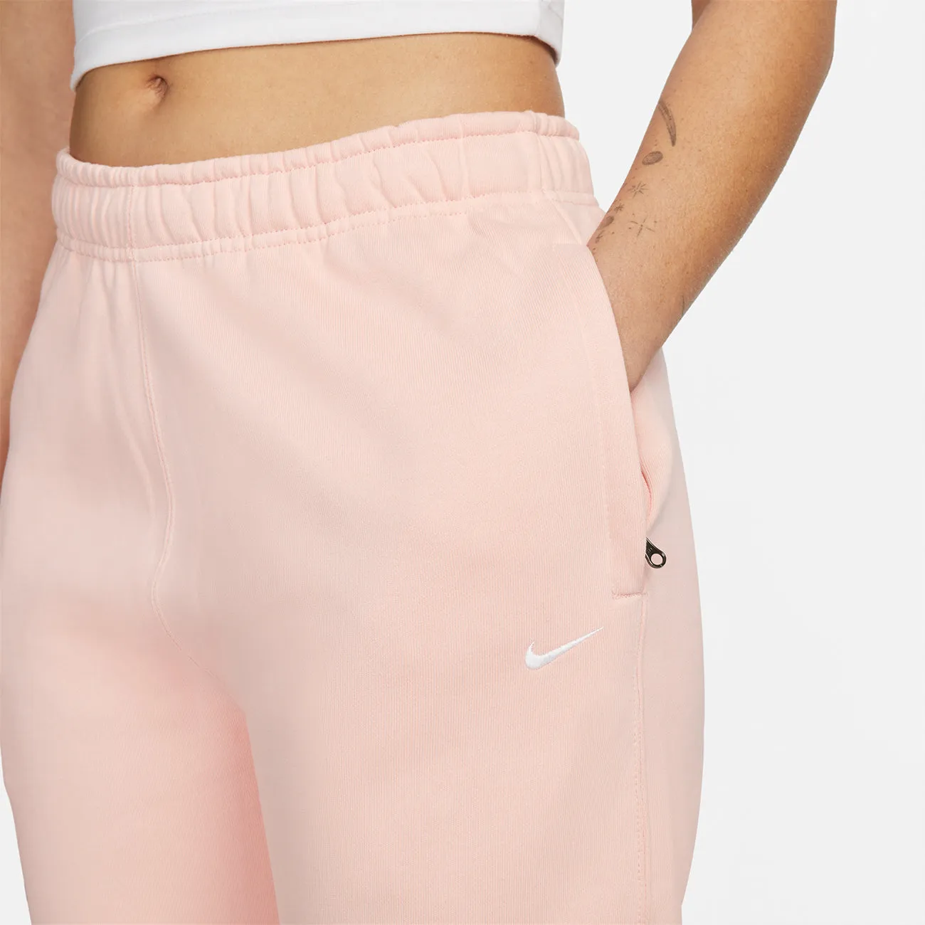 W SOLOSWOOSH FLEECE PANT BLEACHED CORAL WHITE