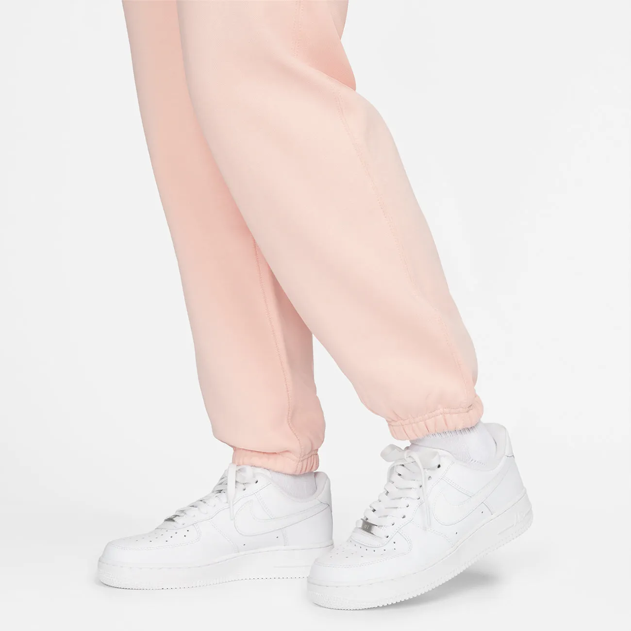 W SOLOSWOOSH FLEECE PANT BLEACHED CORAL WHITE